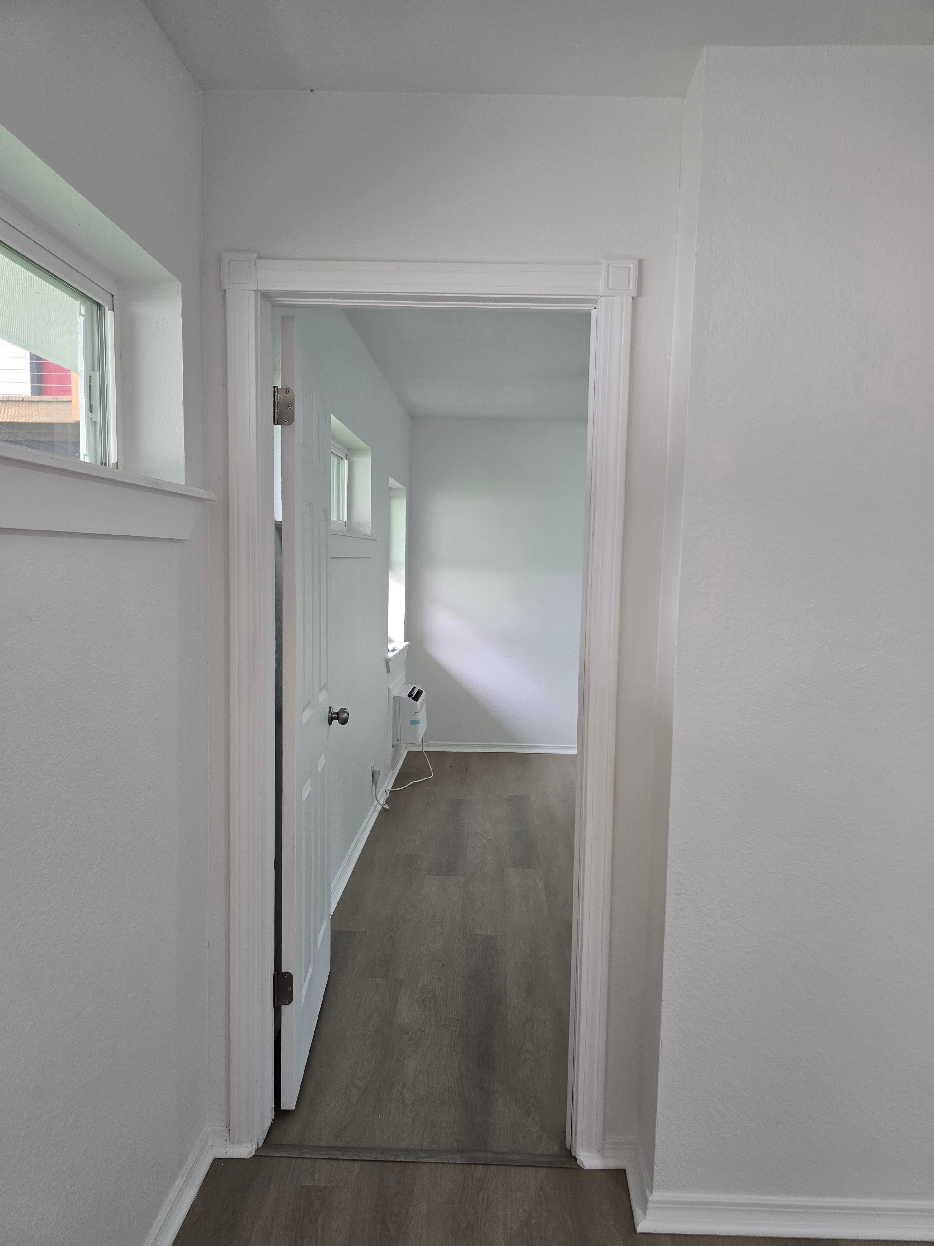 One Bedroom Deluxe bedroom with natural light and new flooring