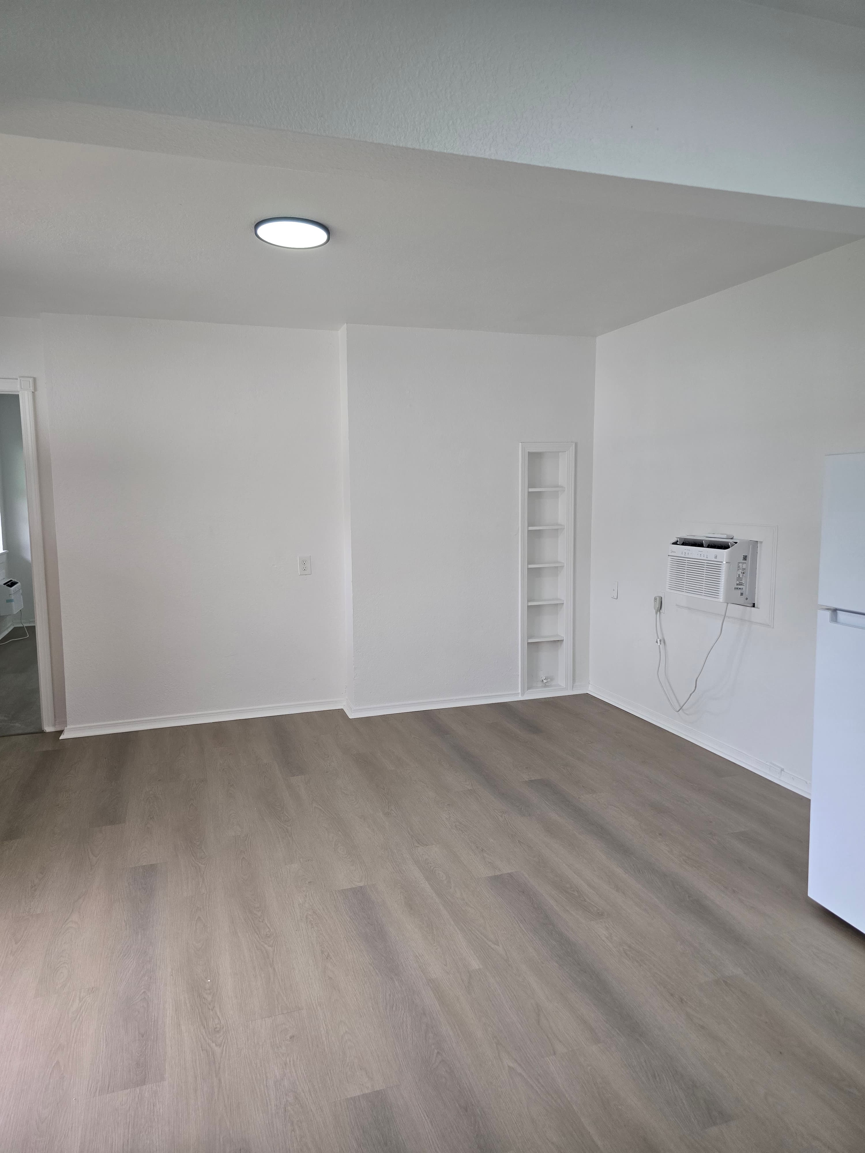 Bright One Bedroom Deluxe living room with new flooring