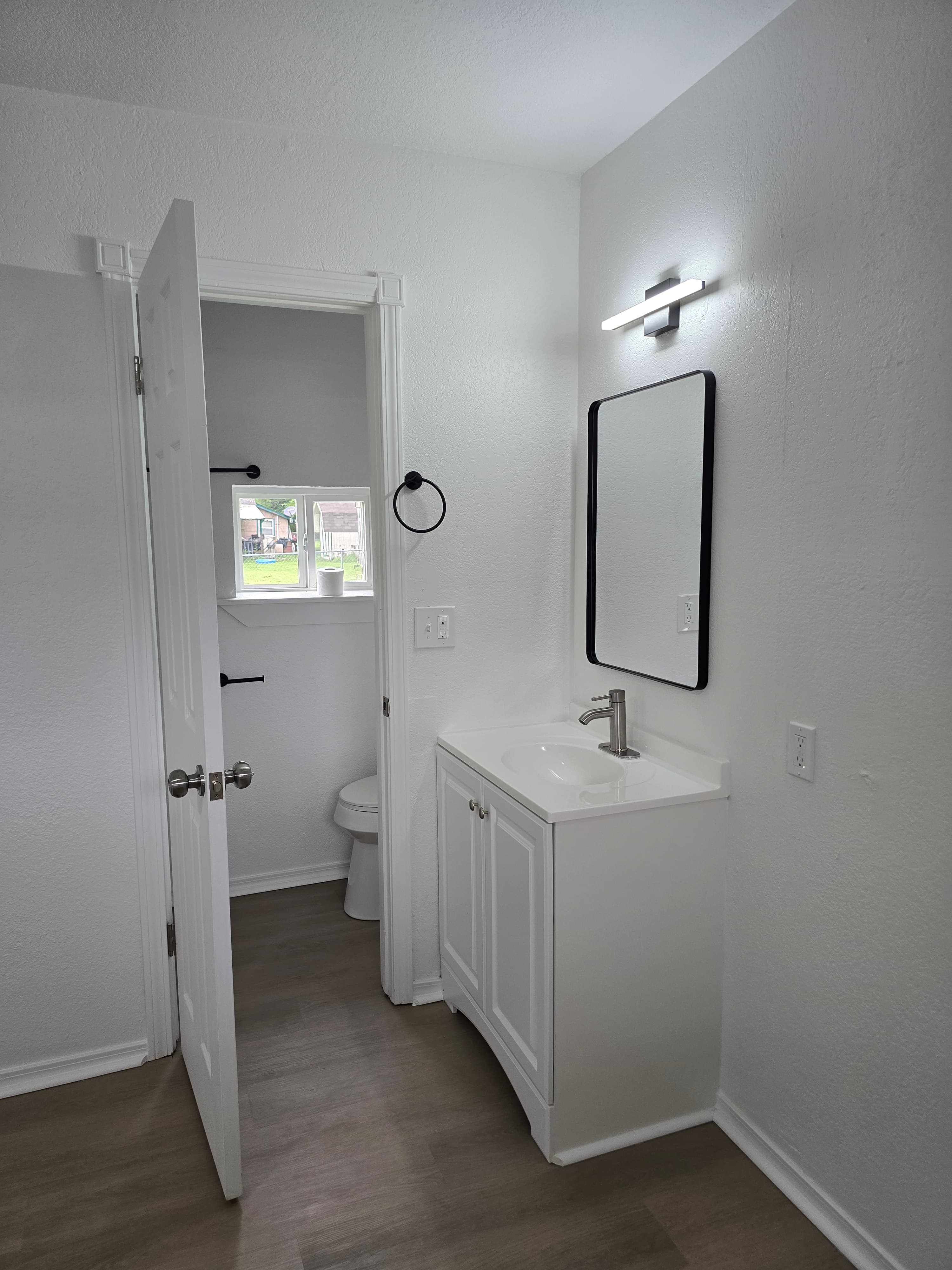 Renovated bathroom vanity in the One Bedroom Deluxe apartment