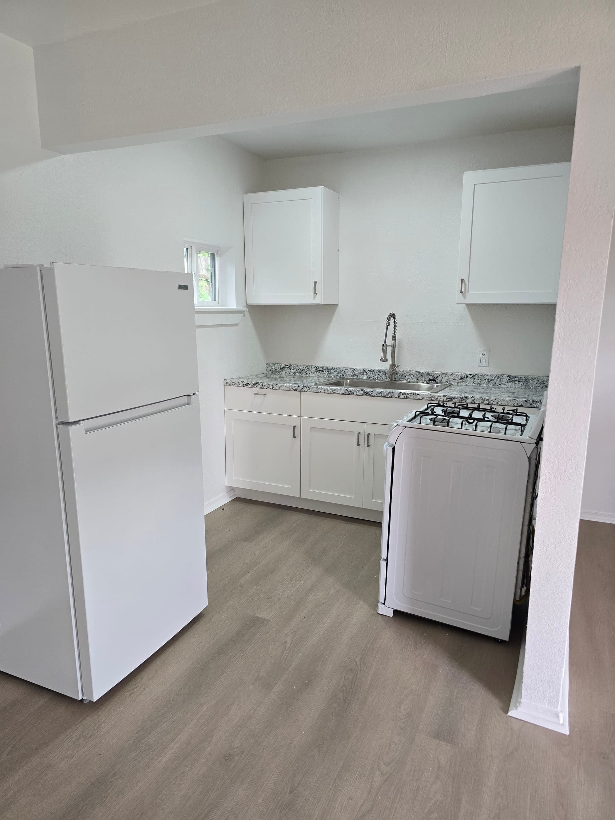Renovated one bedroom apartment kitchen at Stroud Apartments